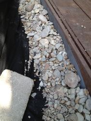 ../images/deck-perimeter/small-rocks-in-screens-closeup.188x250.jpg